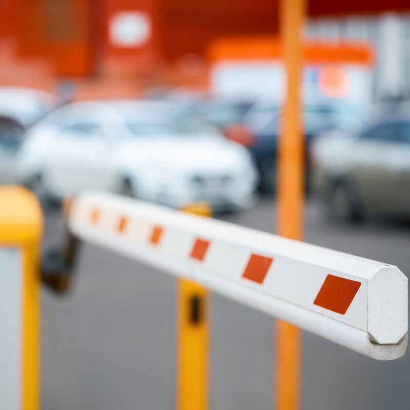 barrier close-up against the background of car parking